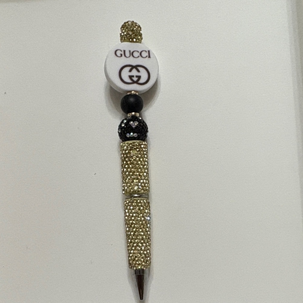 Gold and Black Beaded Writing Instrument